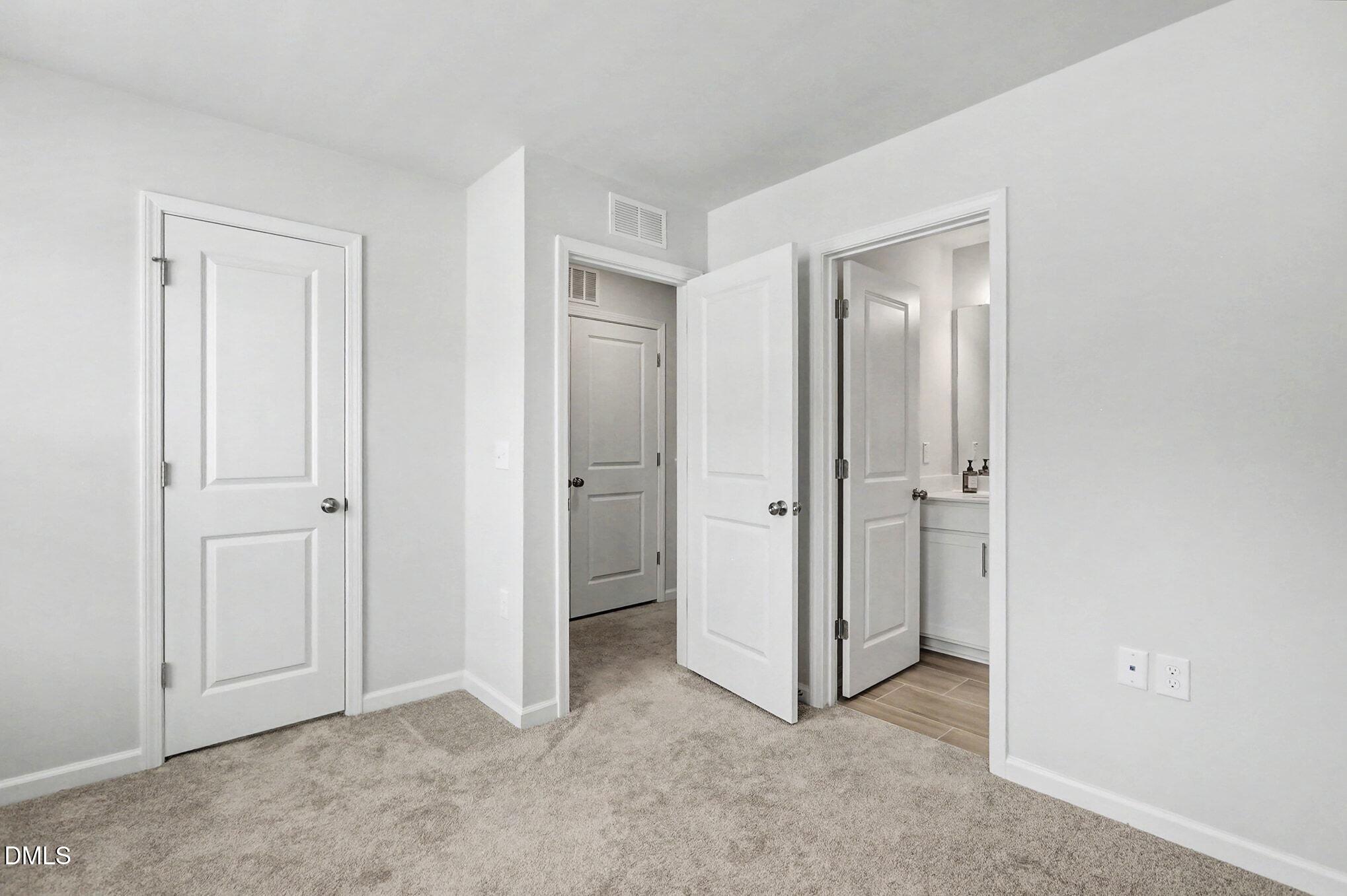 2528 Chert Lane Raleigh, NC 27610 - Photo 13 of 44 an empty room with closet and a bathroom