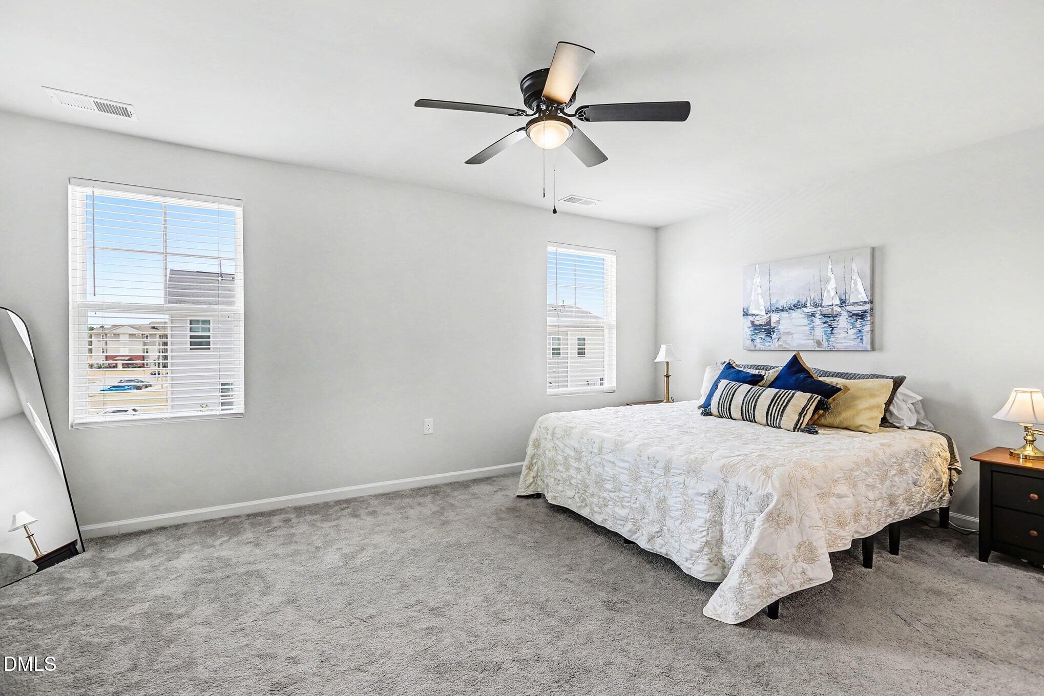 2528 Chert Lane Raleigh, NC 27610 - Photo 15 of 44 a bedroom with a bed and a window