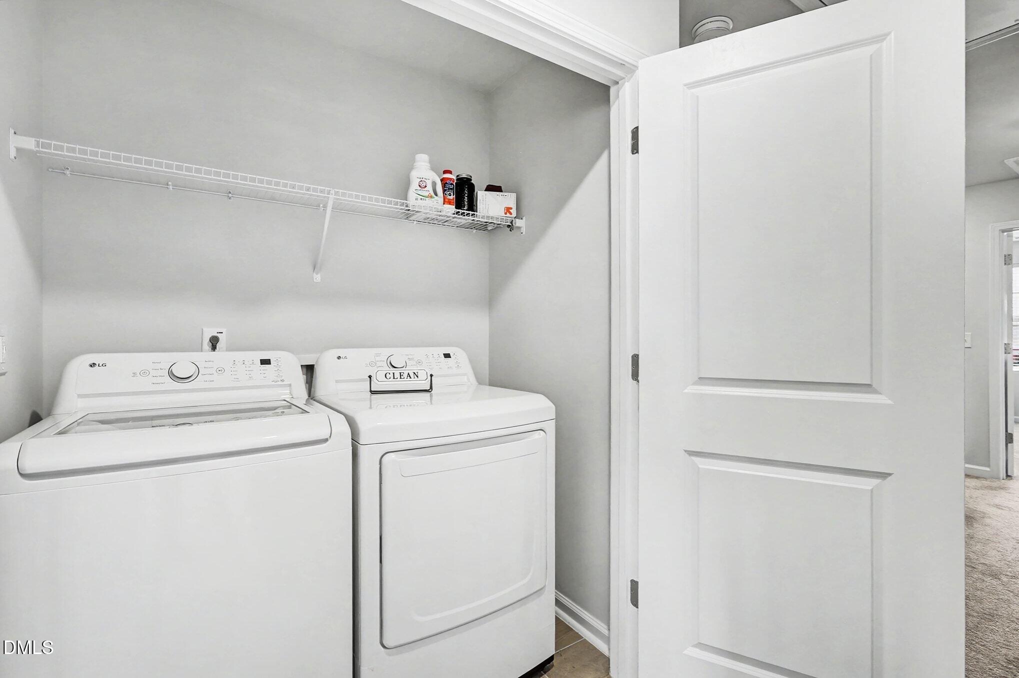 2528 Chert Lane Raleigh, NC 27610 - Photo 20 of 44 a view of storage and utility room with washer and dryer