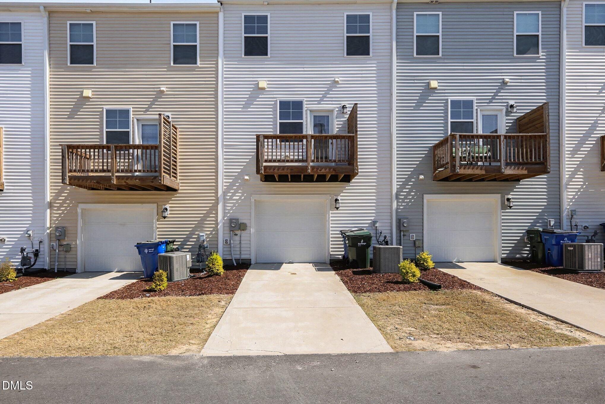 2528 Chert Lane Raleigh, NC 27610 - Photo 24 of 44 a living room with furniture a flat screen tv and a fireplace