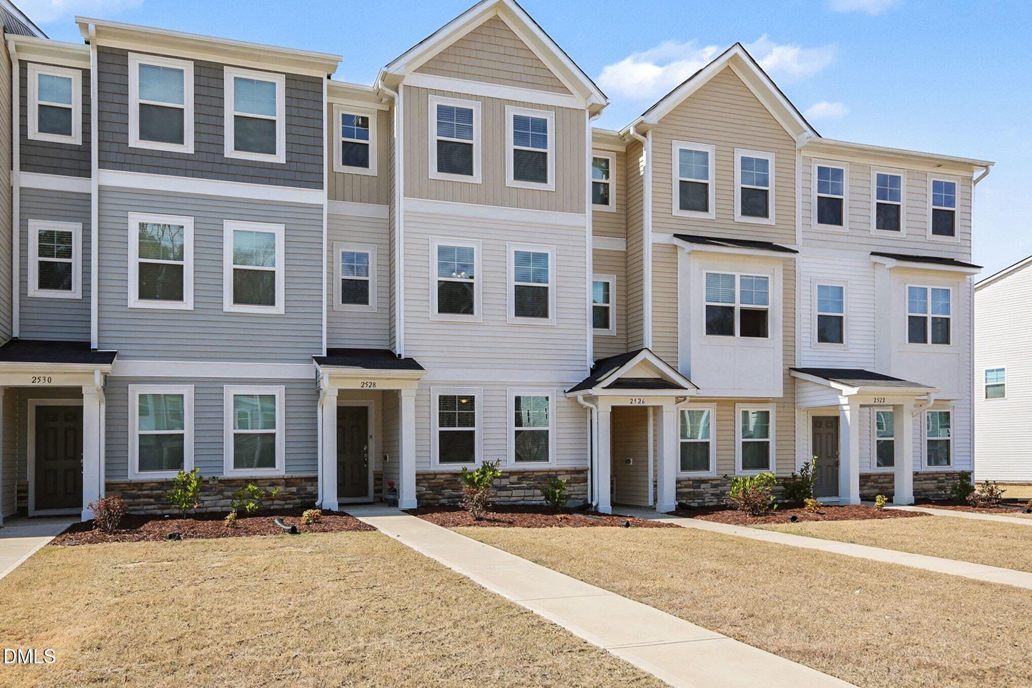 2528 Chert Lane Raleigh, NC 27610 - Photo 2 of 44 a front view of a building with a street