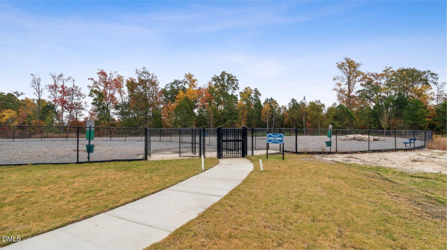 2528 Chert Lane Raleigh, NC 27610 - Photo 36 of 44 a swimming pool with some trees in the background