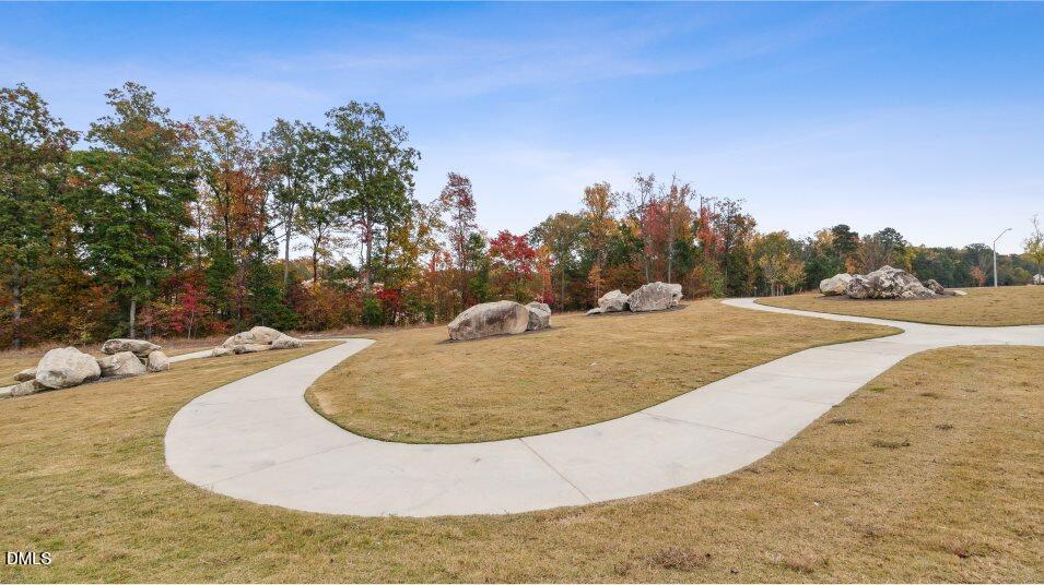 2528 Chert Lane Raleigh, NC 27610 - Photo 37 of 44 a view of a swimming pool with a yard
