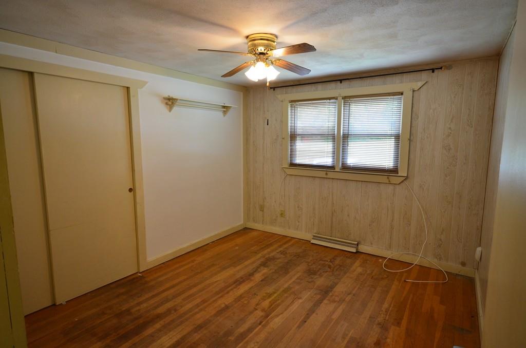 38 Cushing Road Webster, MA 01570 - Photo 11 of 18 wooden floor in an empty room with a window