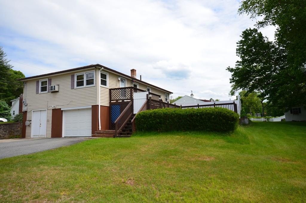 38 Cushing Road Webster, MA 01570 - Photo 3 of 18 a front view of a house with garden