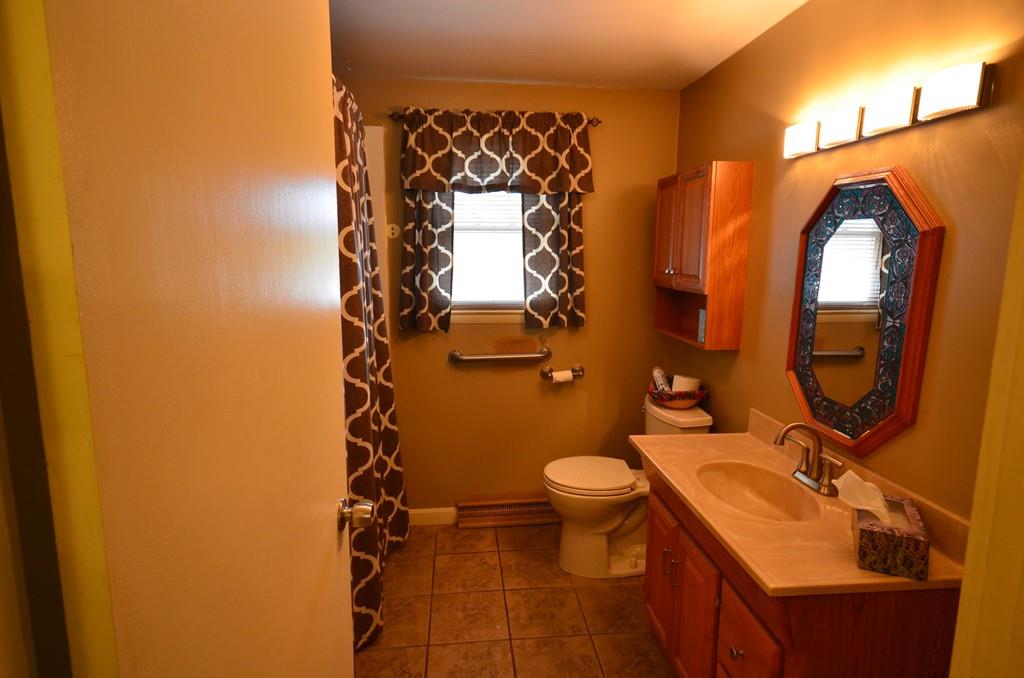 38 Cushing Road Webster, MA 01570 - Photo 10 of 18 a bathroom with a sink and a mirror