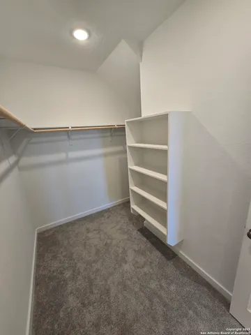 a view of an empty walk in closet