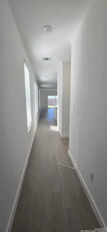 a view of a big room with windows and cabinet