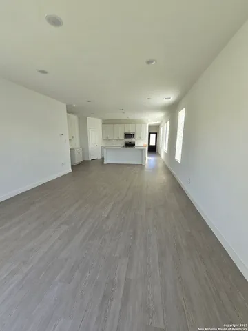 a view of a livingroom with wooden floor