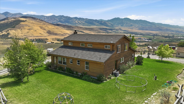 715 Ranch Loop Road Preston, ID 83263 - Photo 56 of 77 Two-story residence featuring wood siding and a dark shingle roof