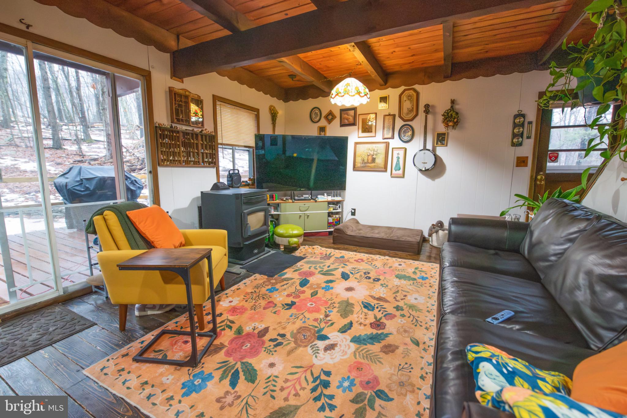 117 Swallow Circle Bushkill, PA 18324 - Photo 11 of 47 a living room with furniture and a flat screen tv