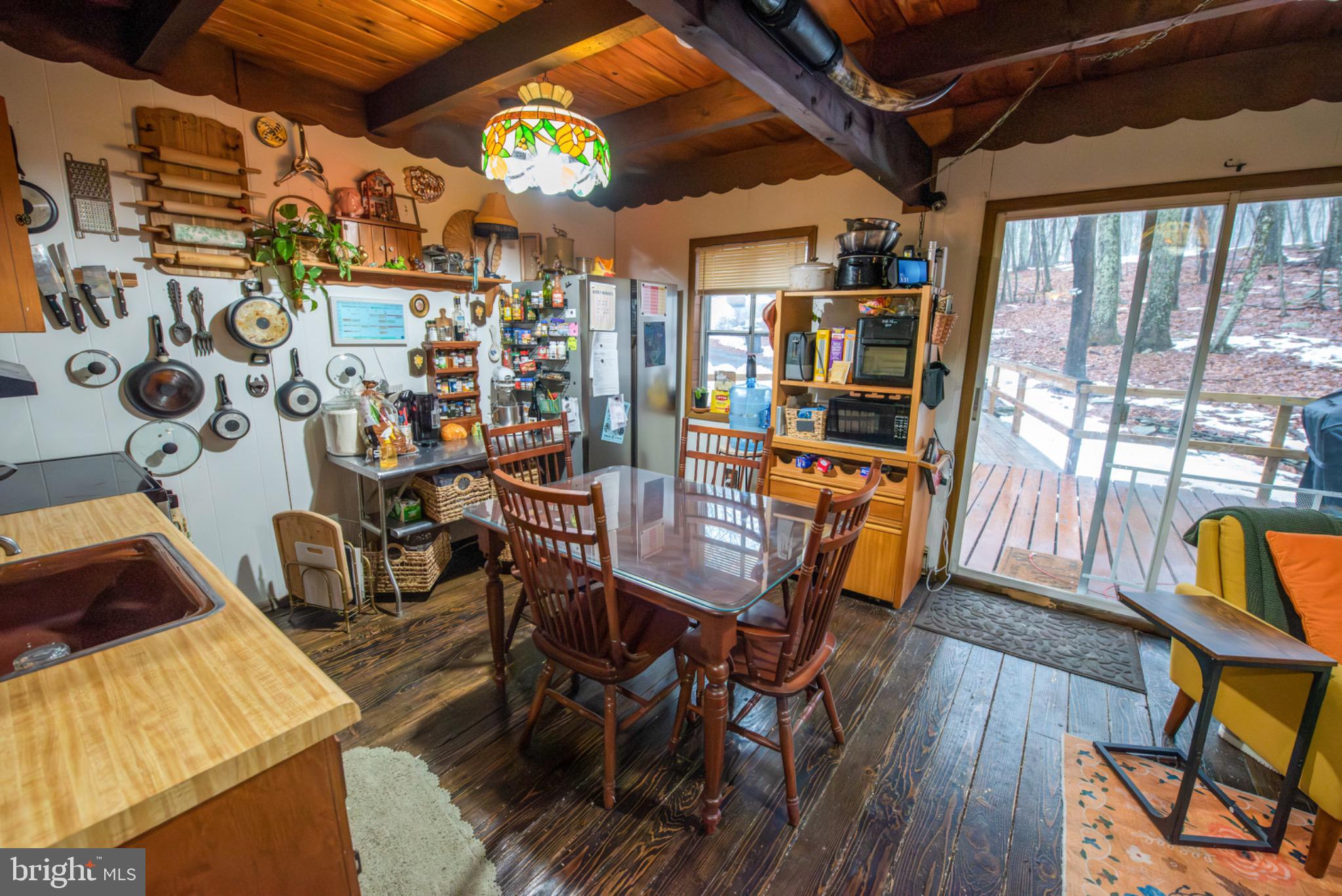117 Swallow Circle Bushkill, PA 18324 - Photo 14 of 47 a view of a dining room with furniture and wooden floor