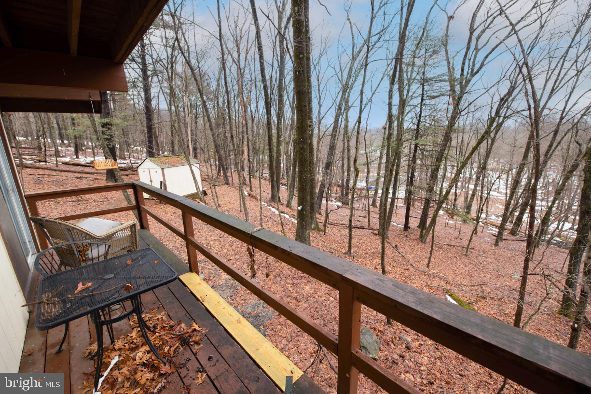 117 Swallow Circle Bushkill, PA 18324 - Photo 19 of 47 a view of balcony with wooden floor and fence