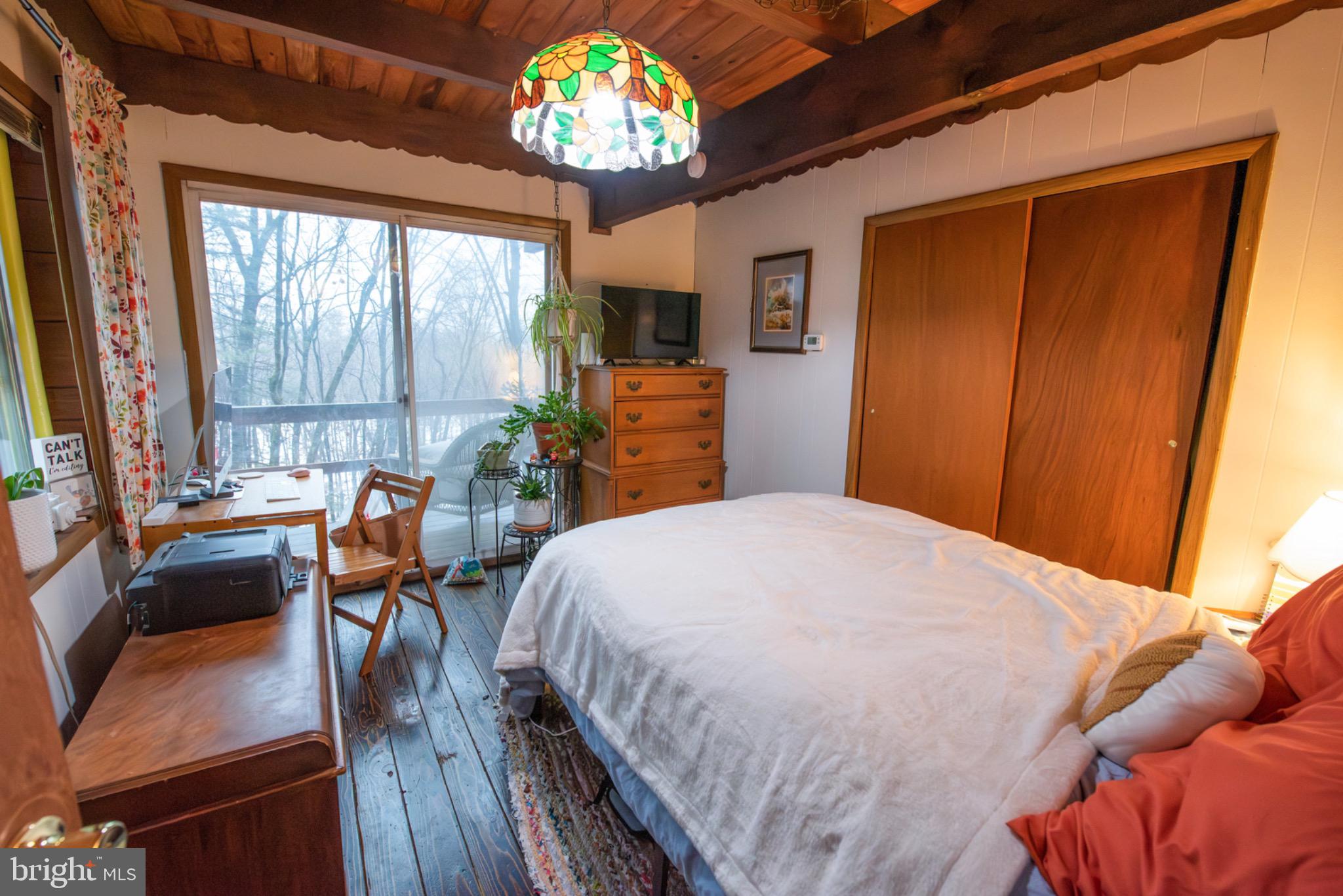 117 Swallow Circle Bushkill, PA 18324 - Photo 21 of 47 a bed sitting in a bedroom next to a window