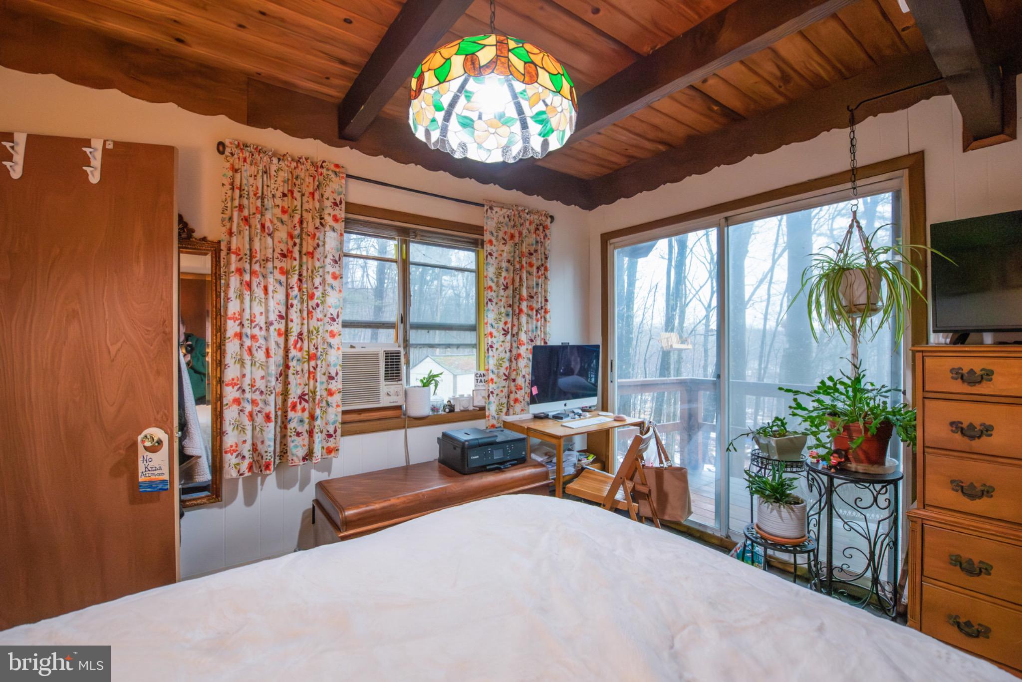 117 Swallow Circle Bushkill, PA 18324 - Photo 22 of 47 a living room with furniture and a flat screen tv