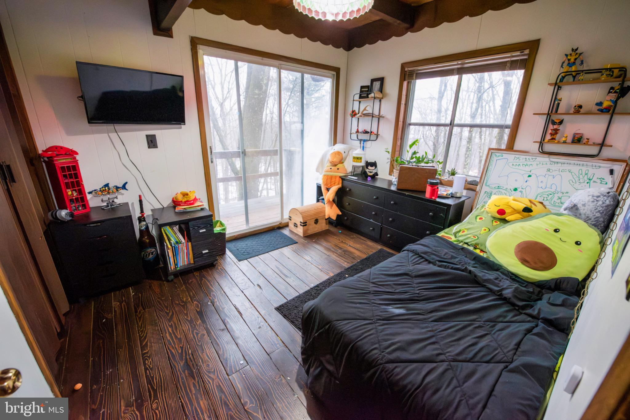 117 Swallow Circle Bushkill, PA 18324 - Photo 25 of 47 a bedroom with furniture and a flat screen tv