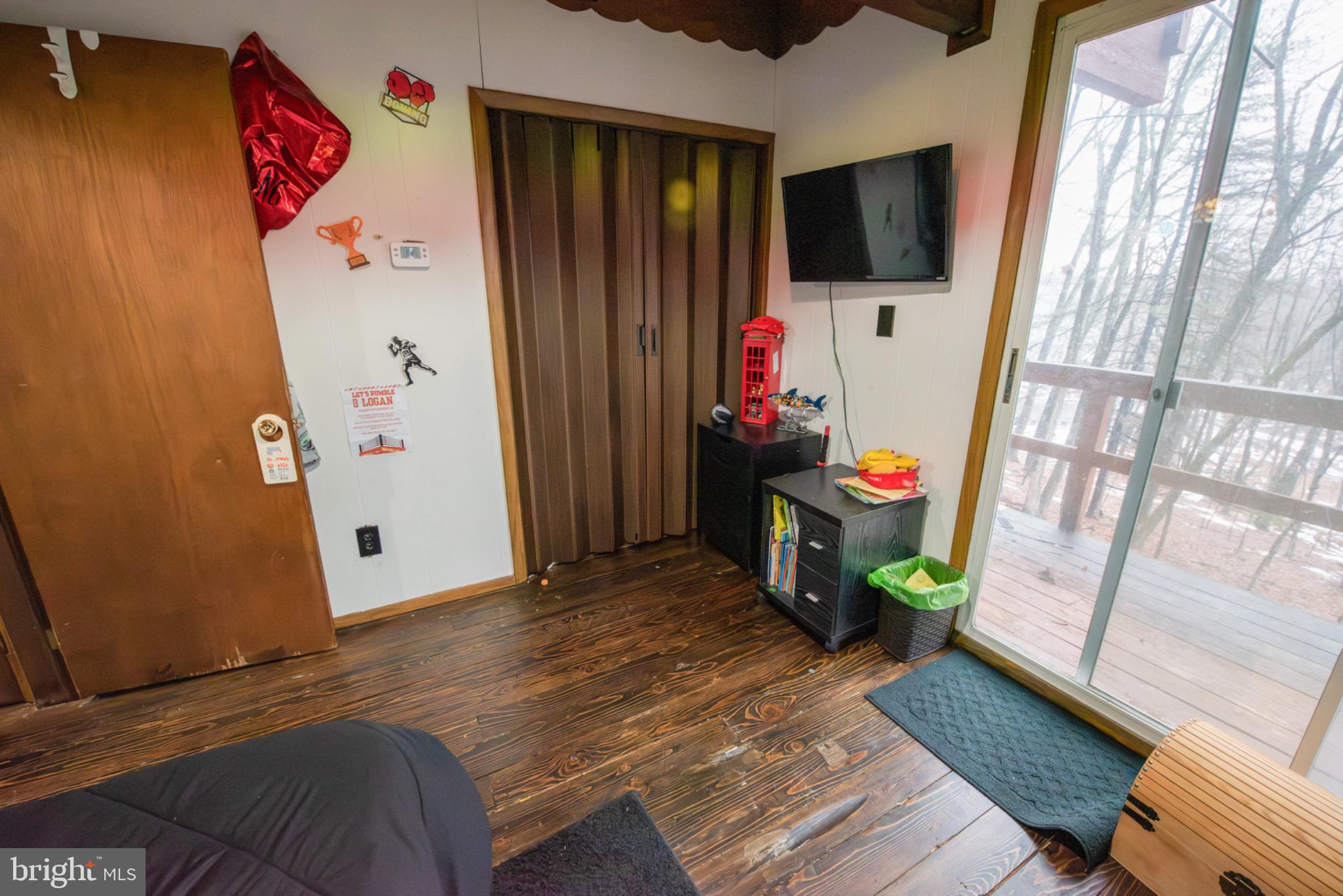 117 Swallow Circle Bushkill, PA 18324 - Photo 28 of 47 a view of a workspace with furniture and a flat screen tv