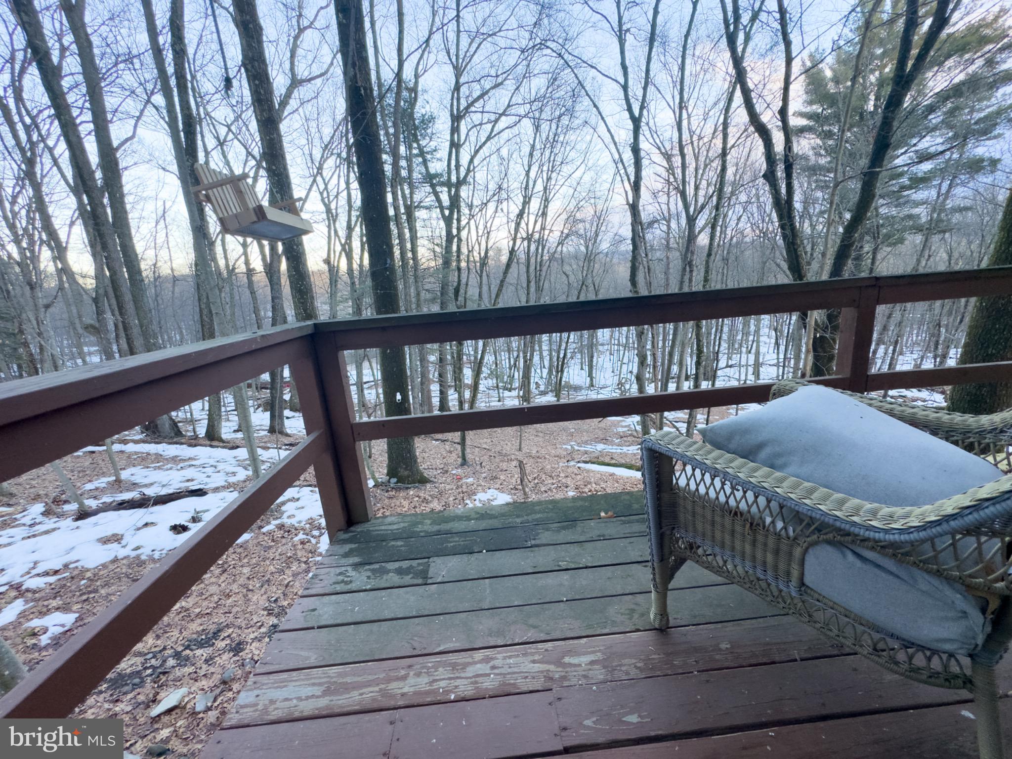 117 Swallow Circle Bushkill, PA 18324 - Photo 29 of 47 a view of balcony with wooden floor and outdoor seating
