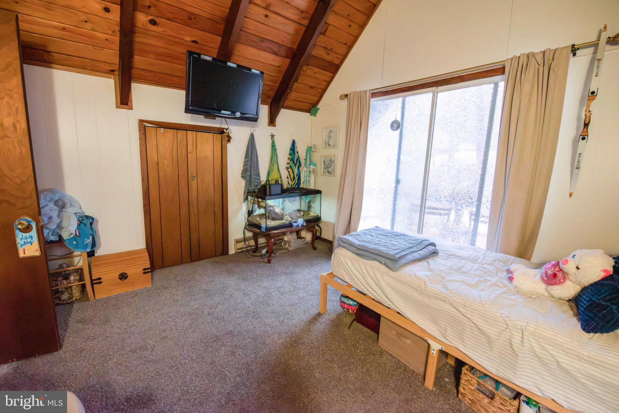 117 Swallow Circle Bushkill, PA 18324 - Photo 35 of 47 a bedroom with furniture and a window