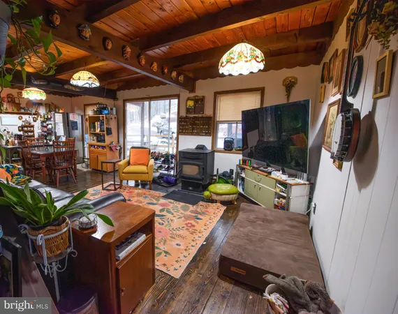 a living room with fireplace furniture and a flat screen tv