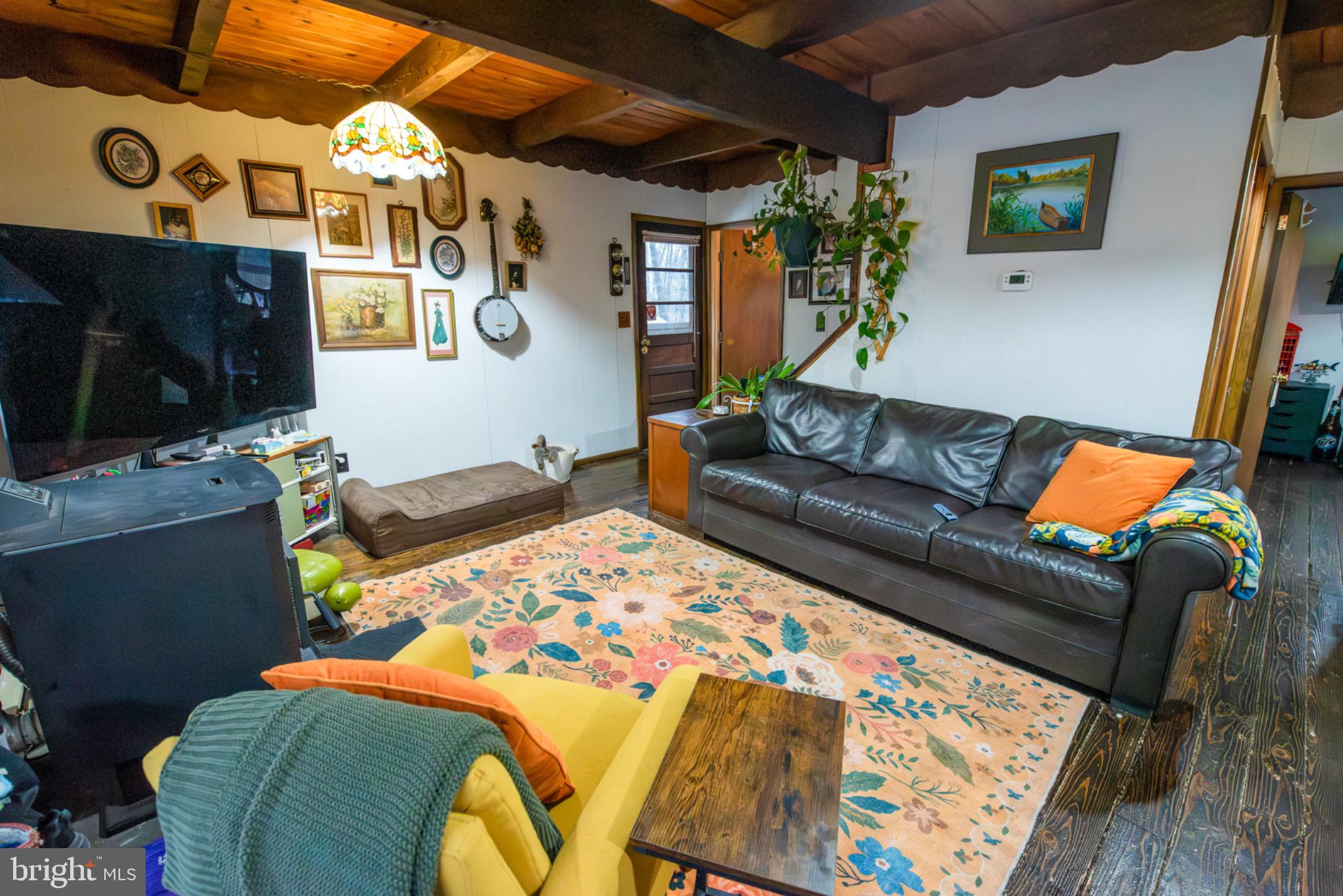 117 Swallow Circle Bushkill, PA 18324 - Photo 9 of 47 a living room with furniture and a flat screen tv