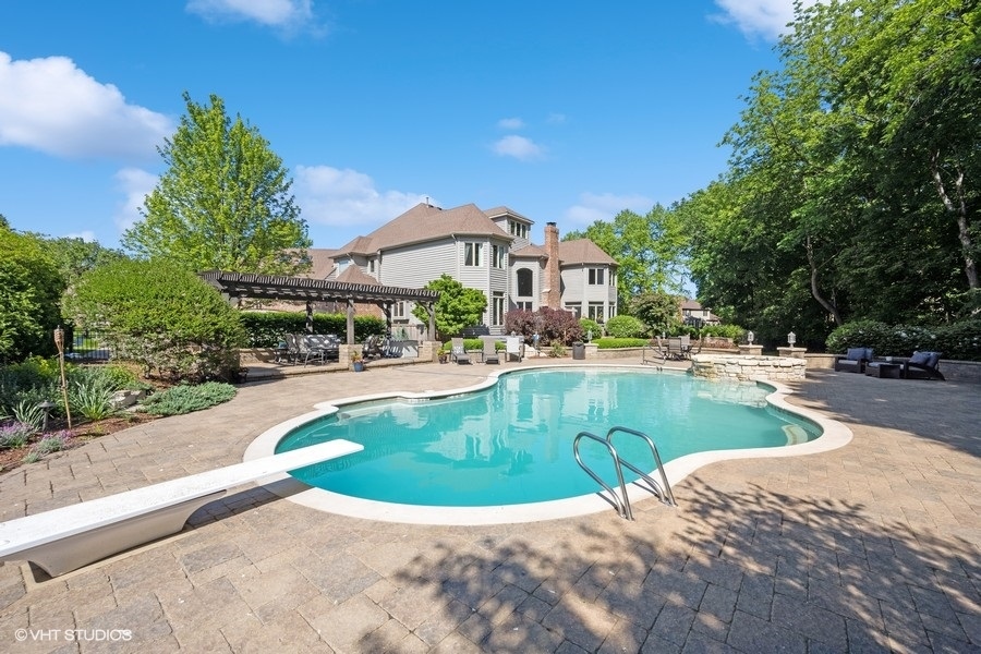 627 Alberosky Way Batavia, IL 60510 - Photo 2 of 73 a view of a swimming pool and a trees
