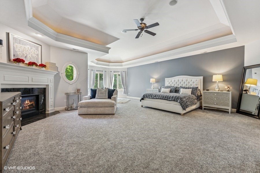 627 Alberosky Way Batavia, IL 60510 - Photo 21 of 73 a bedroom with furniture and a fireplace