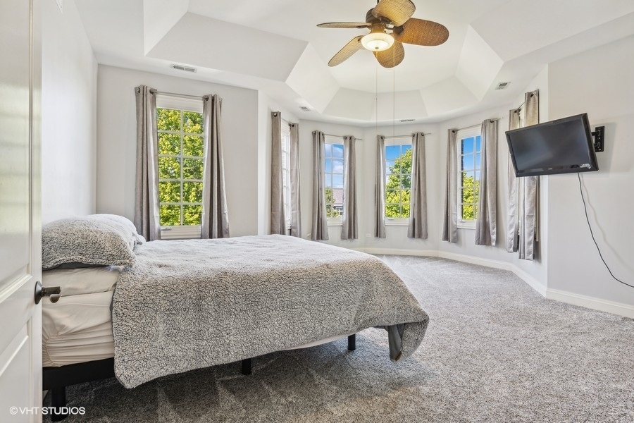 627 Alberosky Way Batavia, IL 60510 - Photo 30 of 73 a bedroom with a bed and flat screen tv