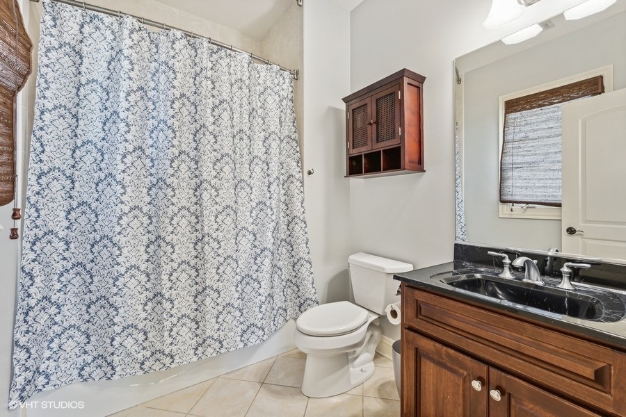 627 Alberosky Way Batavia, IL 60510 - Photo 31 of 73 a bathroom with a granite countertop toilet and a sink