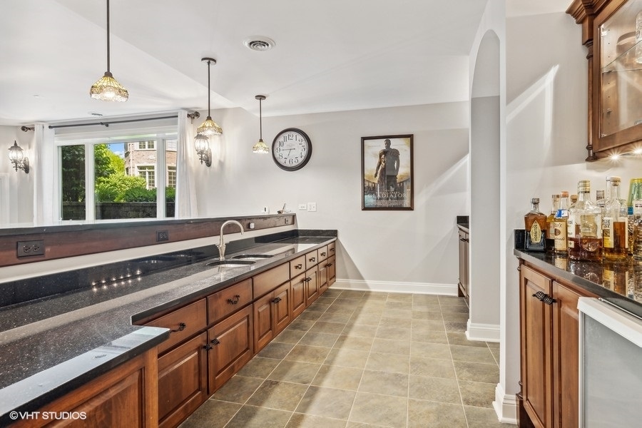 627 Alberosky Way Batavia, IL 60510 - Photo 37 of 73 a large kitchen with stainless steel appliances a stove and a window
