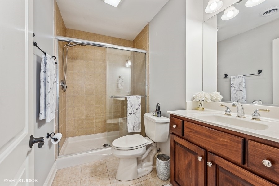 627 Alberosky Way Batavia, IL 60510 - Photo 41 of 73 a bathroom with a sink a toilet a mirror and shower