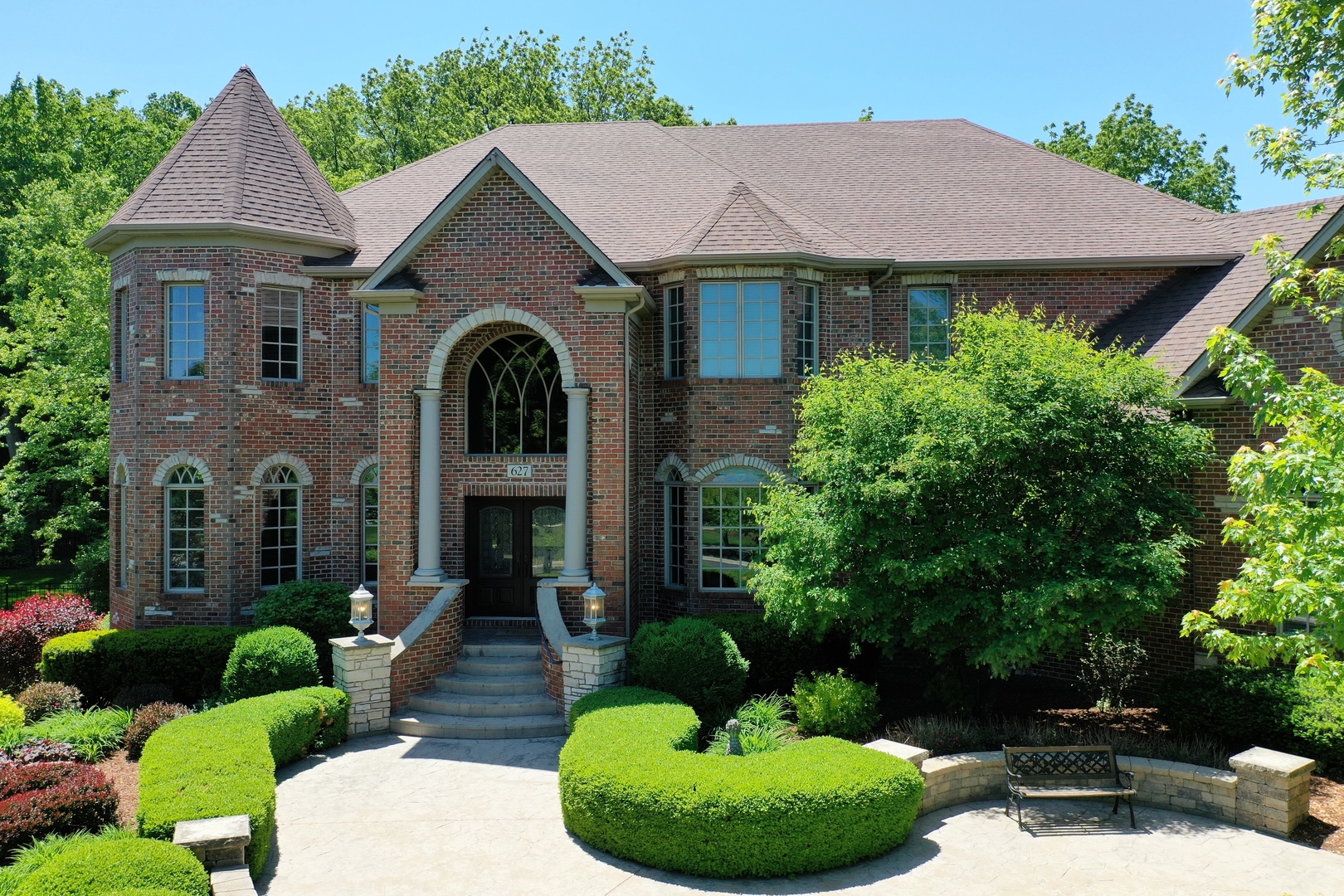627 Alberosky Way Batavia, IL 60510 - Photo 66 of 73 a front view of a house with a garden and plants