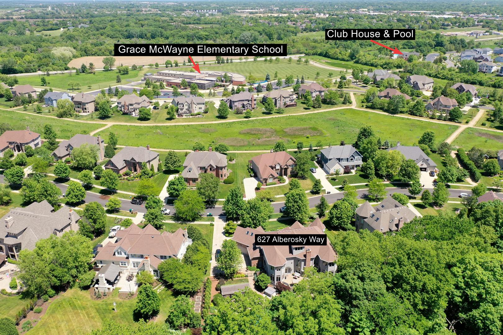 627 Alberosky Way Batavia, IL 60510 - Photo 71 of 73 a view of a city with lots of residential buildings and mountain view in back