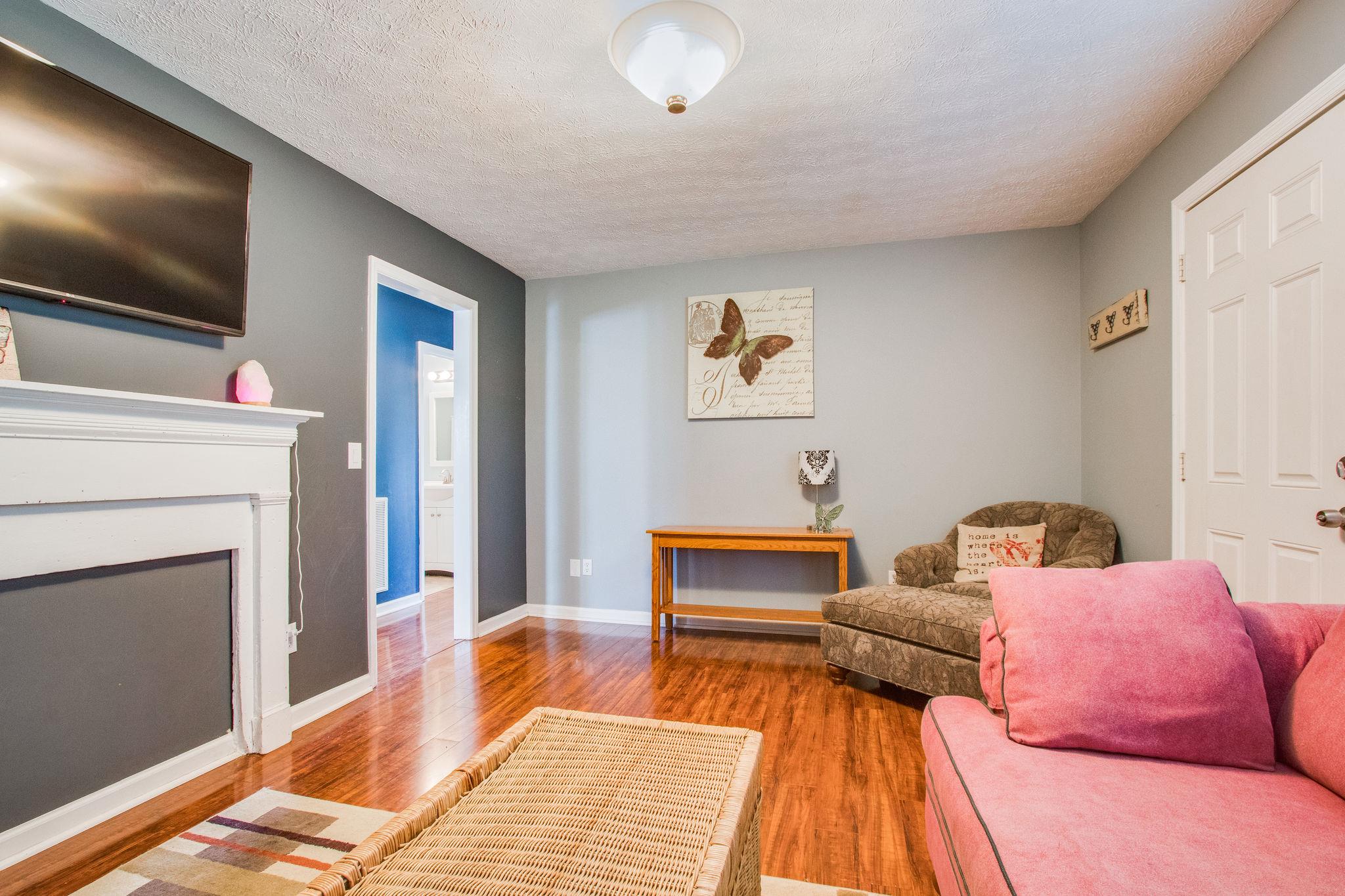 580 Curd Road Mount Juliet, TN 37122 - Photo 4 of 17 a bedroom with furniture and a fireplace