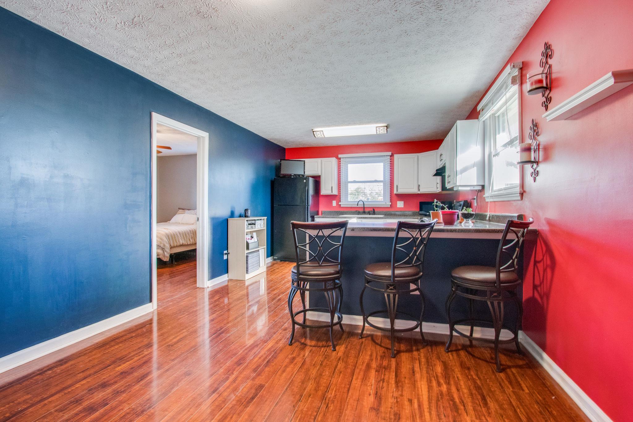 580 Curd Road Mount Juliet, TN 37122 - Photo 7 of 17 a view of a dining room with furniture and wooden floor
