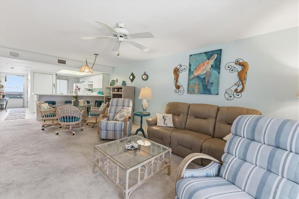 6800 Placida Road, Unit 192 Englewood, FL 34224 - Photo 14 of 33 a living room with furniture kitchen view and a window