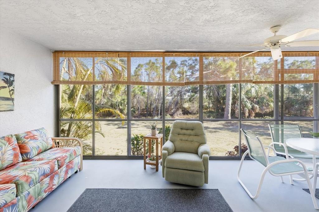 6800 Placida Road, Unit 192 Englewood, FL 34224 - Photo 24 of 33 a living room with furniture and a large window