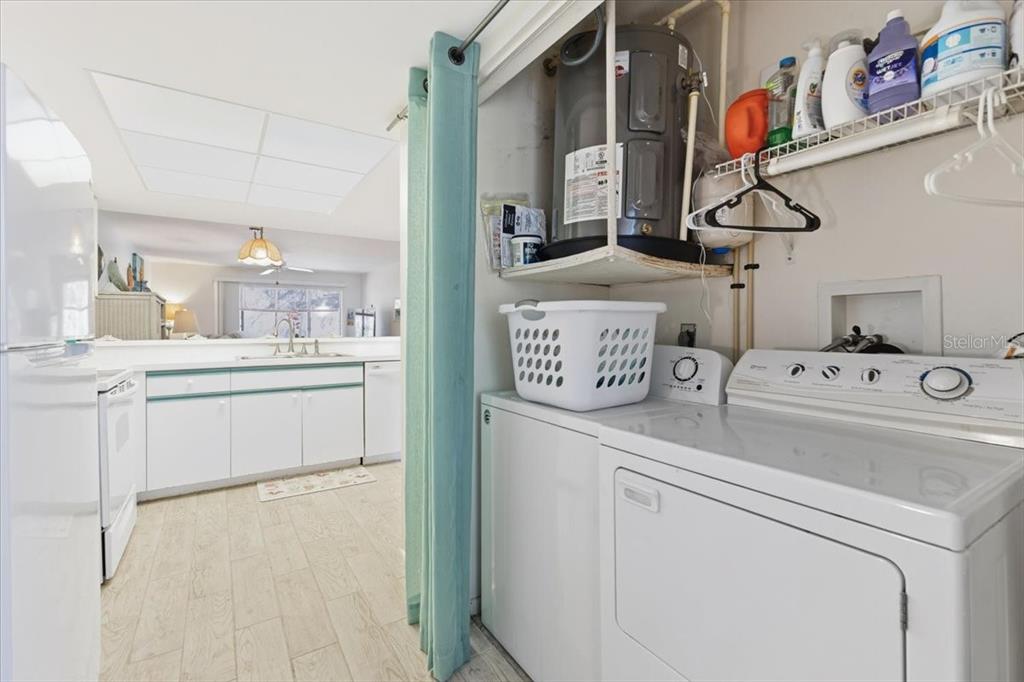 6800 Placida Road, Unit 192 Englewood, FL 34224 - Photo 7 of 33 a utility room with dryer and washer