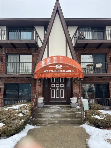 a view of a hallway with wooden door