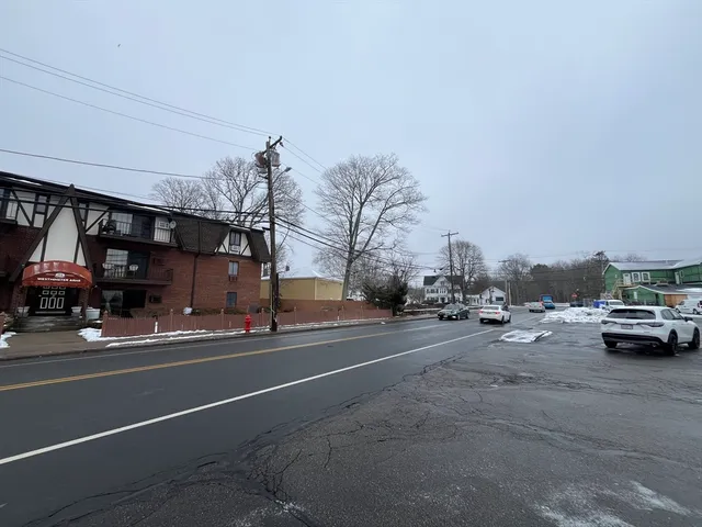 a view of a city street with cars