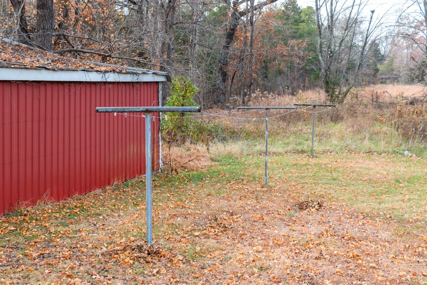 1089 Straightstone Road Gretna, VA 24557 - Photo 15 of 26 a backyard of a house with a small yard and tree
