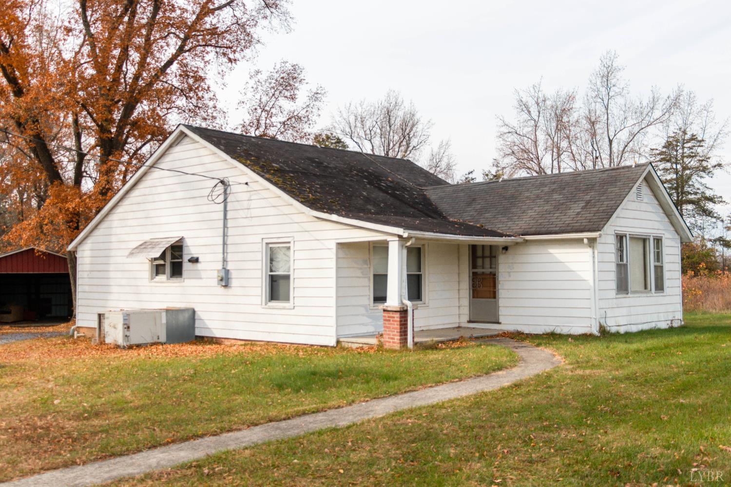 1089 Straightstone Road Gretna, VA 24557 - Photo 5 of 26 a view of a yard in front of a house with large trees