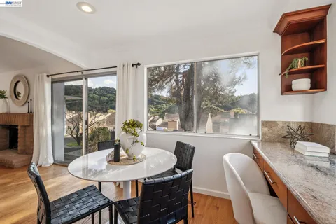 a dining room with furniture and window