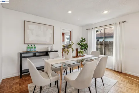 a view of a dining room with furniture window and outside view