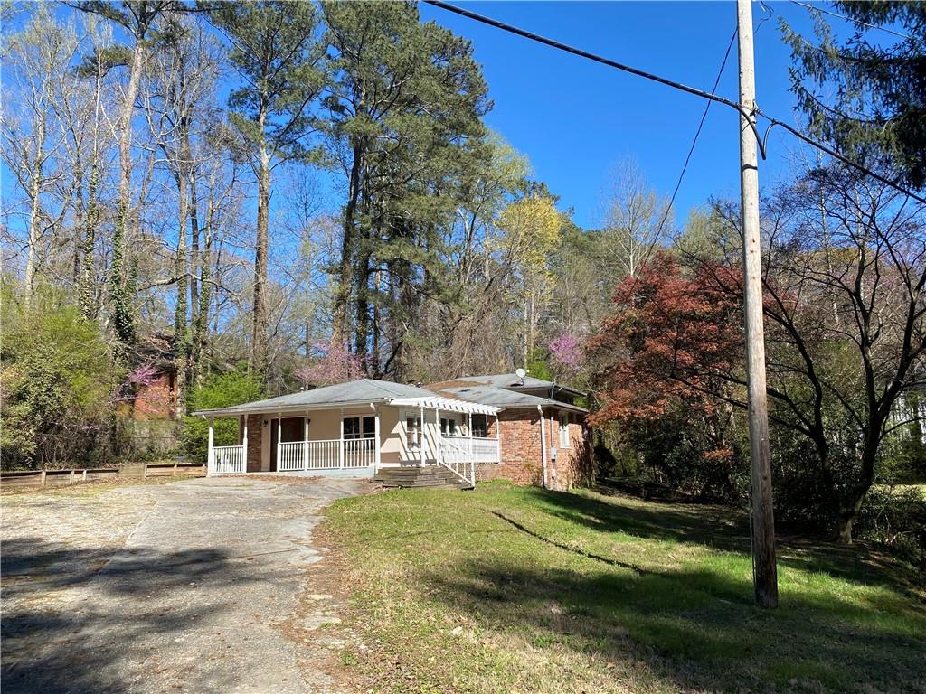 265 Mayfield Road Alpharetta, GA 30009 - Photo 1 of 1 a front view of a house with a garden