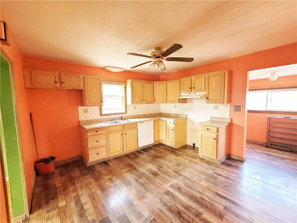2340 Mercer West Middlesex Road West Middlesex, PA 16159 - Photo 11 of 36 a kitchen with a stove a sink and a refrigerator