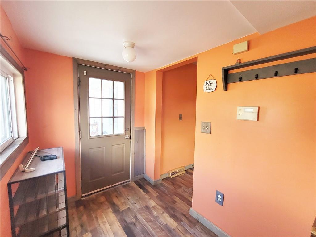 2340 Mercer West Middlesex Road West Middlesex, PA 16159 - Photo 12 of 36 a view of a hallway with wooden floor and a bathroom