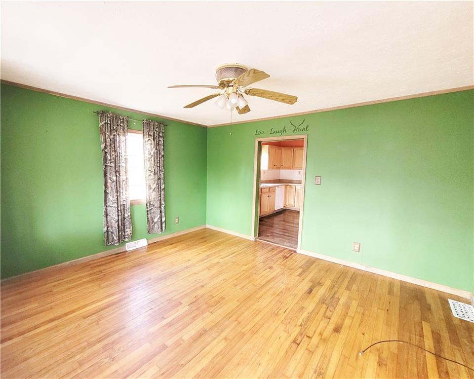2340 Mercer West Middlesex Road West Middlesex, PA 16159 - Photo 15 of 36 a bedroom with a bed and a chandelier