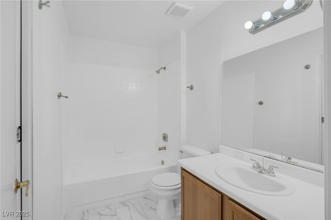 7030 Burcot Avenue, Unit F108 Las Vegas, NV 89156 - Photo 16 of 18 Bathroom with tub / shower combination and vanity
