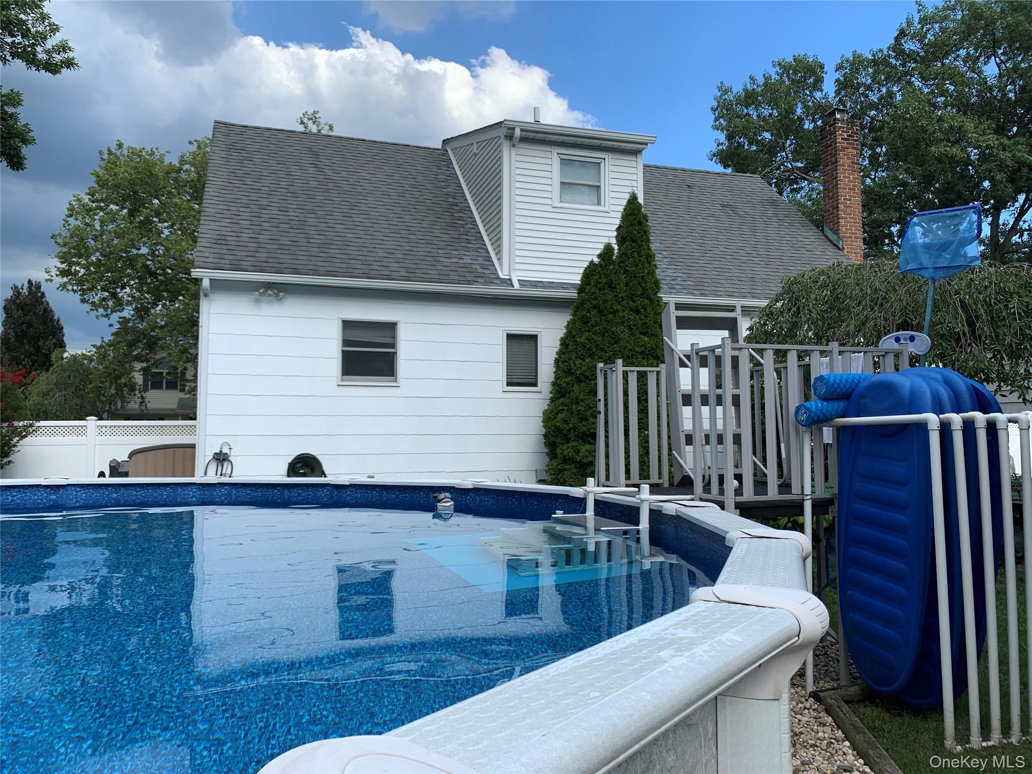 10 Roxbury Street Farmingdale, NY 11735 - Photo 25 of 25 a view of house with outdoor seating space